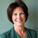 Portrait of Dr. Evelyn Reed, a friendly professional woman.