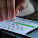 A tablet or smartphone screen displaying a user interface with progress bars and positive emojis, representing digital progress sharing and positive feedback.