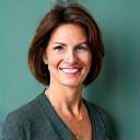 Portait of Elara Vance, a professional woman in her early 40s smiling confidently.